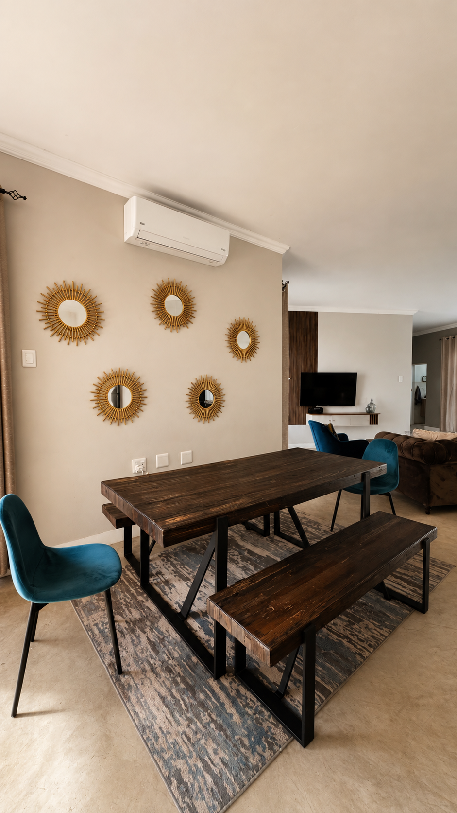 Dining table and sunburst mirrors at Sango on 9 Euphoria